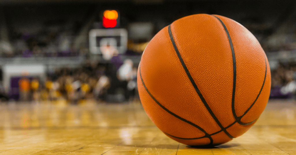 Image of a basketball on a court to encourage audience to watch college basketball with HTC TV Now